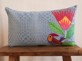 This cushion is a one of a kind piece, a collaboration between skilled artisans in the Philippines and South Africa. Embroidered hand loomed cotton on the front, and linen on the back