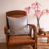 Cushion cover in graphic Binakol hand loomed cotton, beige colour, whirlpool motif. A traditional craft of the Philippines.