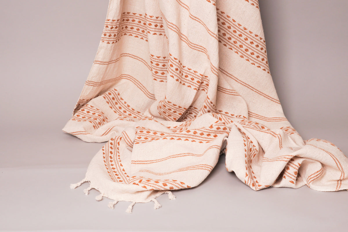 Hand-loomed throw in natural unbleached cotton,  by Storie