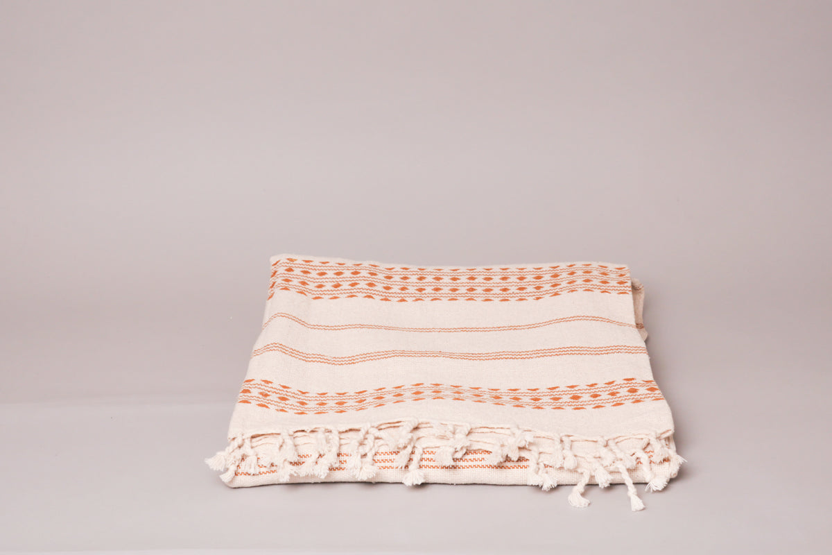 Hand-loomed throw in natural unbleached cotton,  by Storie