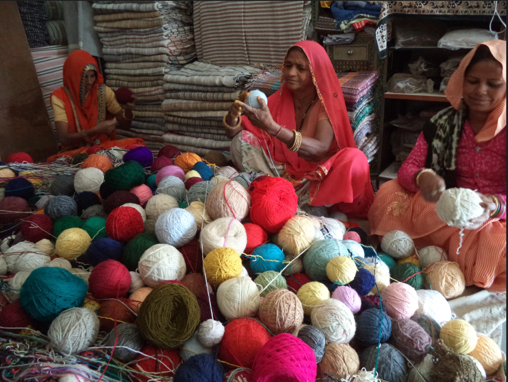 Women artisans sorting wool.
