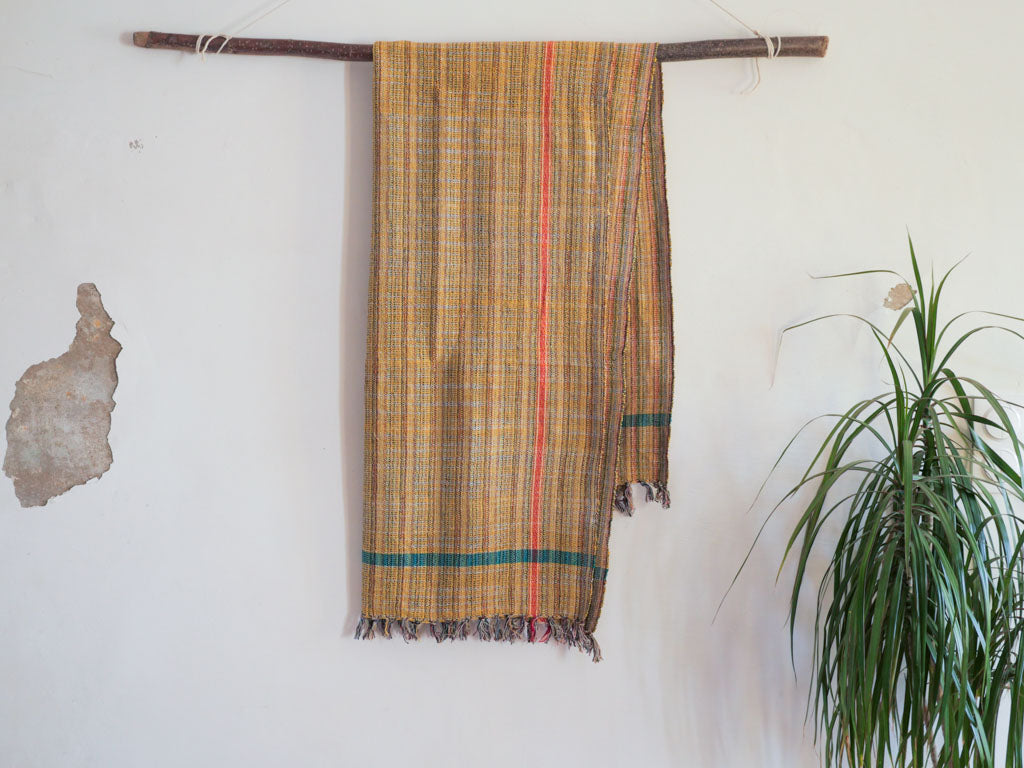 Handwoven cotton towel or throw, yellow. Mixed-yarn weave.