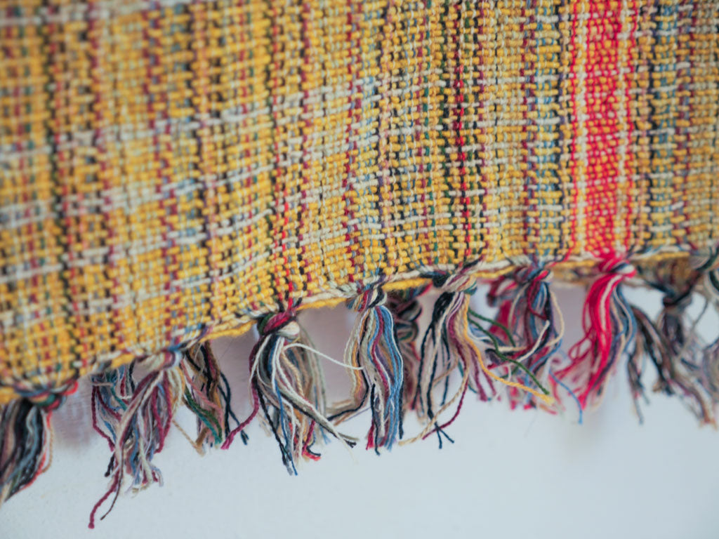 Handwoven cotton towel or throw, yellow. Mixed-yarn weave.