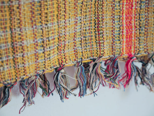 Handwoven cotton towel or throw, yellow. Mixed-yarn weave.