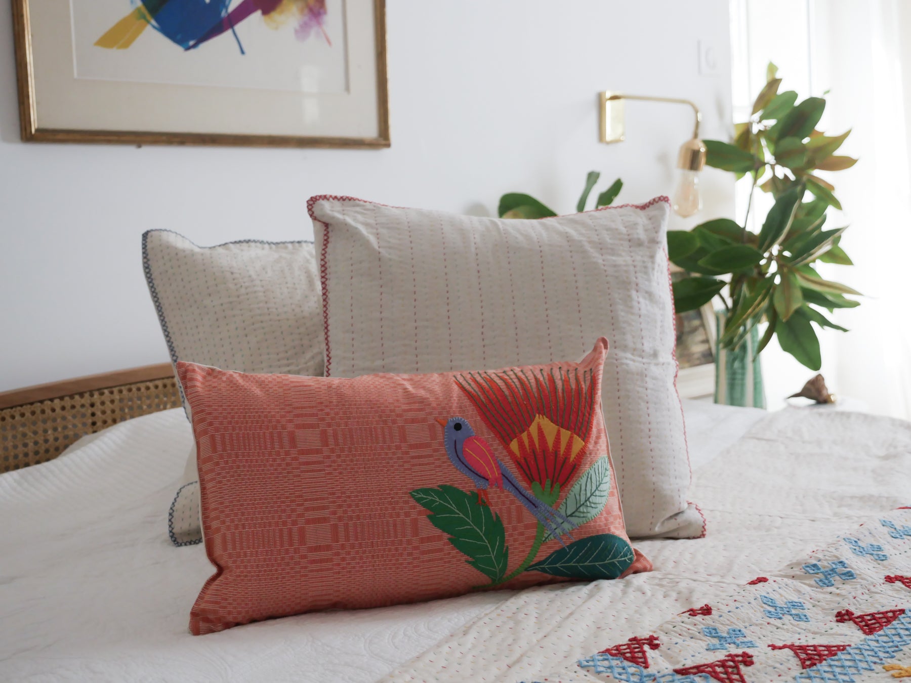 Hand loomed binakol cushion, with applique birds and flowers.