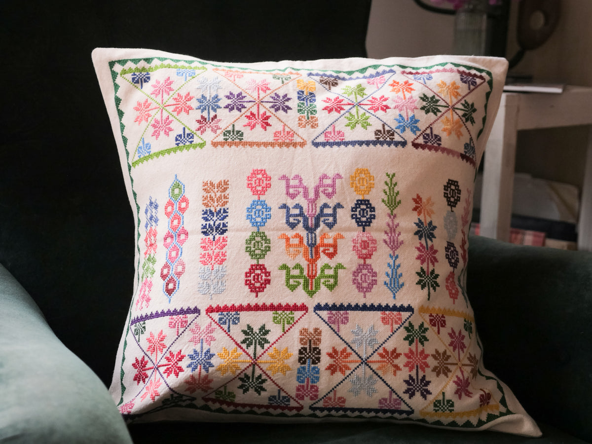 Hand embroidered cushion cover.