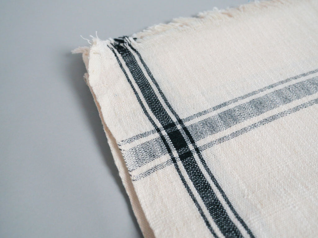 Handwoven towel: ecru cotton with black edge