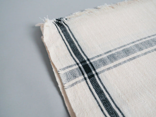 Handwoven towel: ecru cotton with black edge