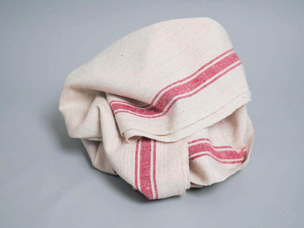 Handwoven towel: ecru cotton with pink edge