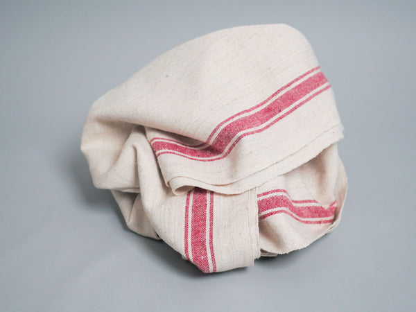Handwoven towel: ecru cotton with pink edge