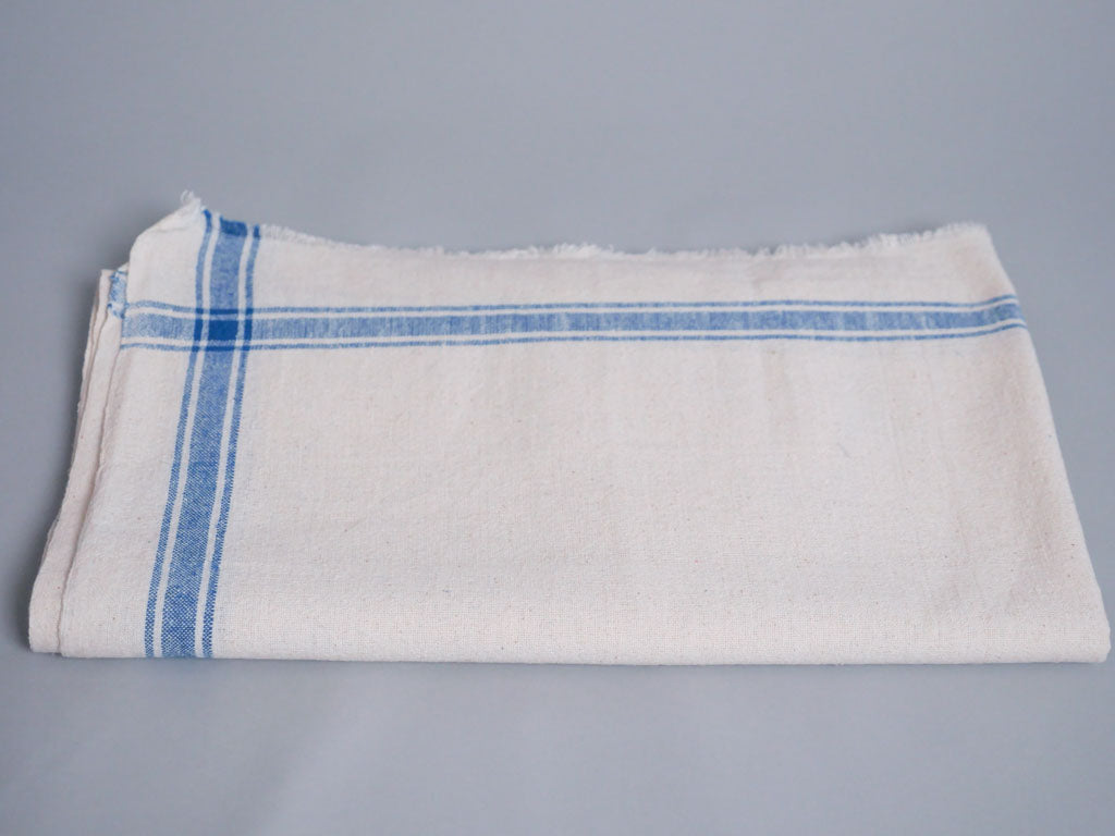 Handwoven towel: ecru cotton with blue edge
