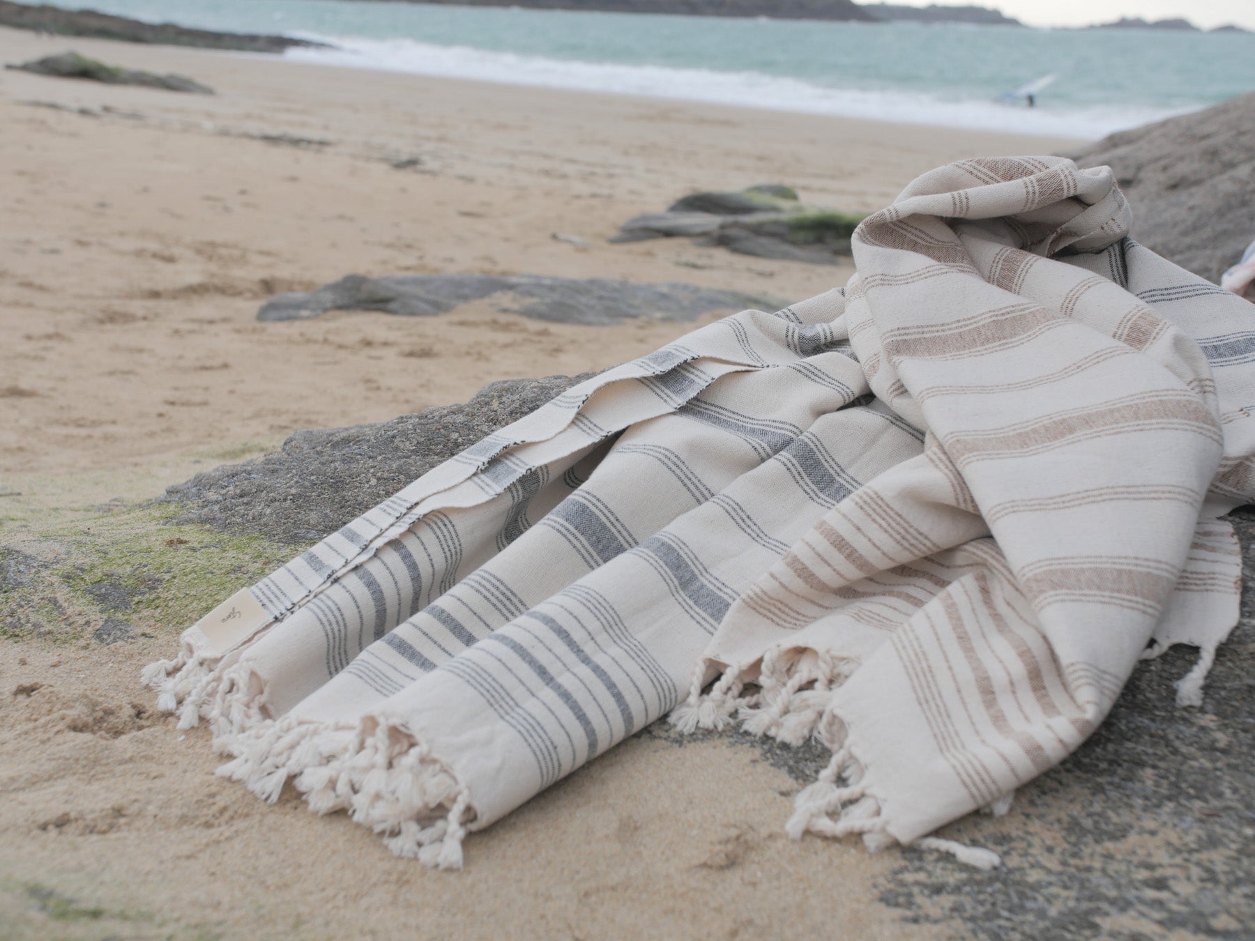 Hand loomed towels on the beach