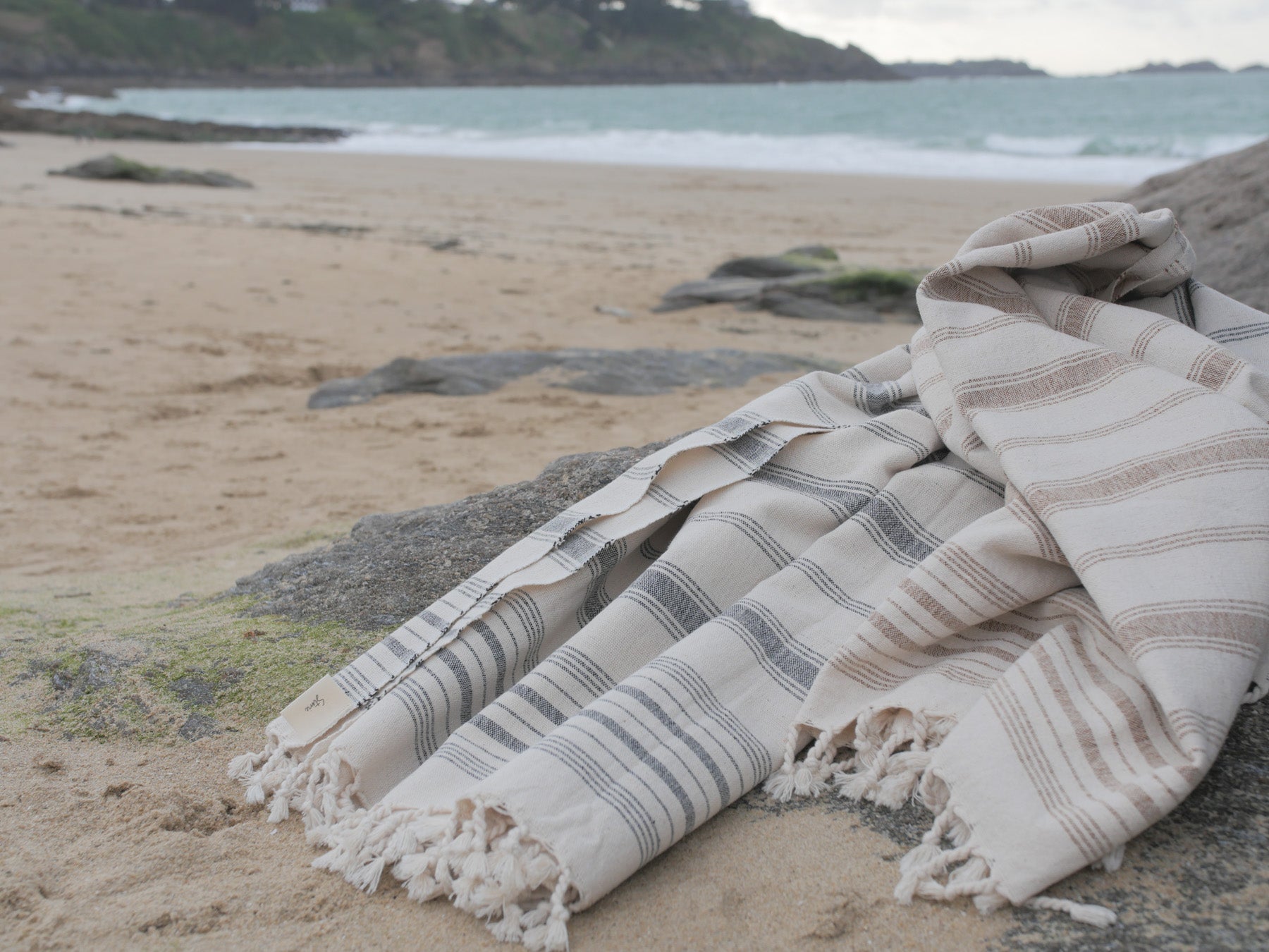 Hand loomed towel on the beach