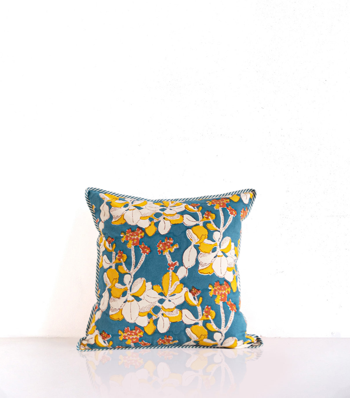 Block printed cotton cushion cover with an iris motif, 40 x 40 cm in a gorgeous deep blue green.