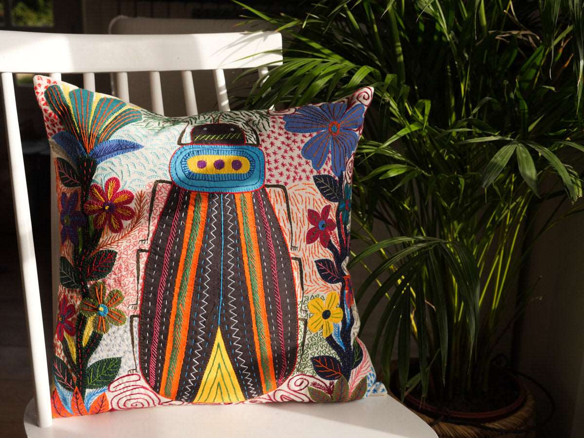 Hand embroidered cushion, made by the women of Heartworks in South Africa. 