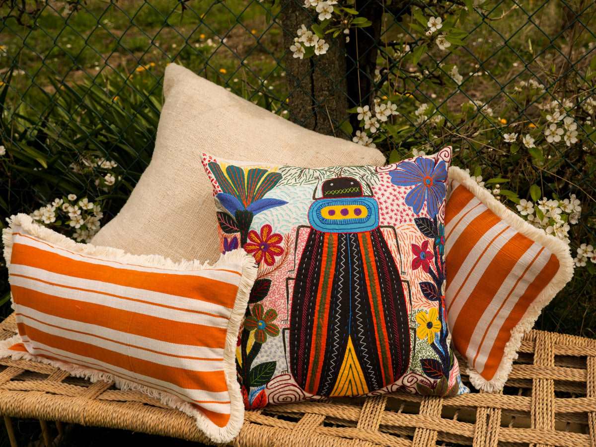 Hand embroidered cushion, made by the women of Heartworks in South Africa. 