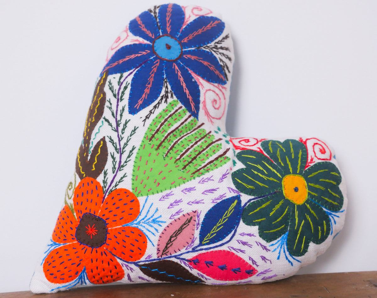 Heart shaped cushion, hand embroidered in South Africa.
