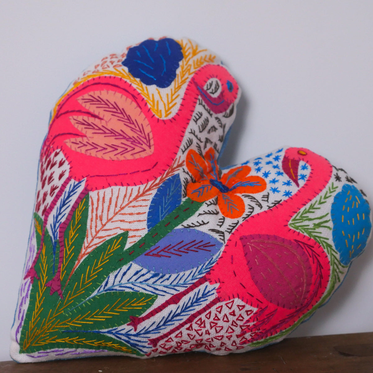 Heart shaped cushion, hand embroidered by a association of women in Cape Town.
