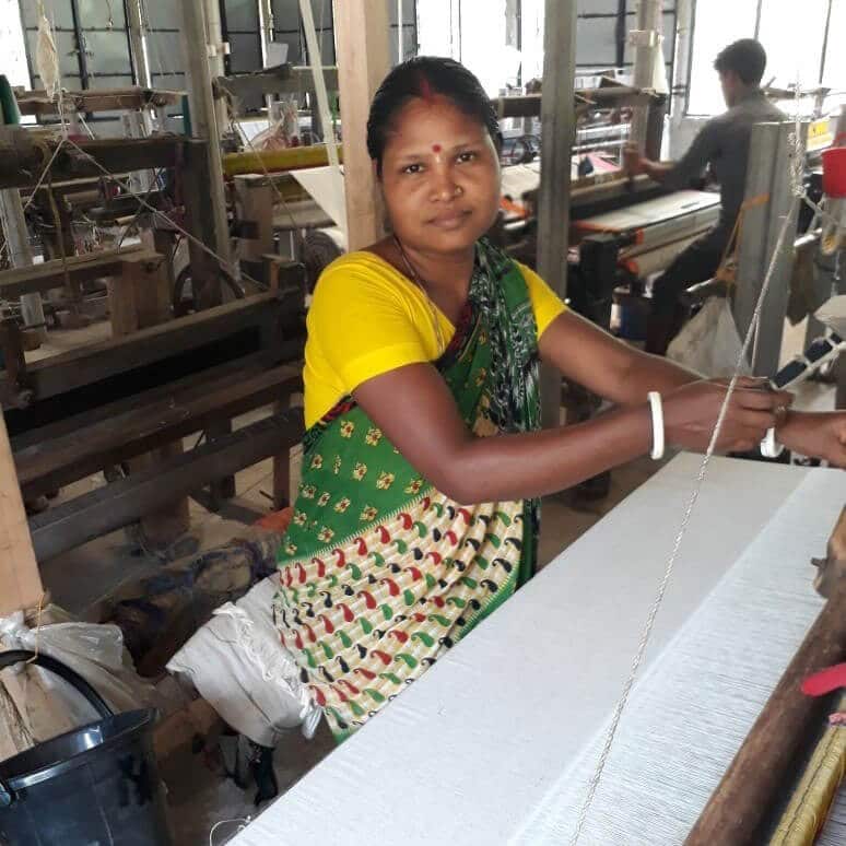 Weaving with recycled cotton in Bangladesh. 