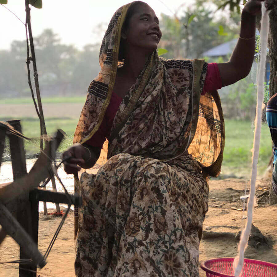 Spinning cotton with recycled cotton in Bangladesh.
